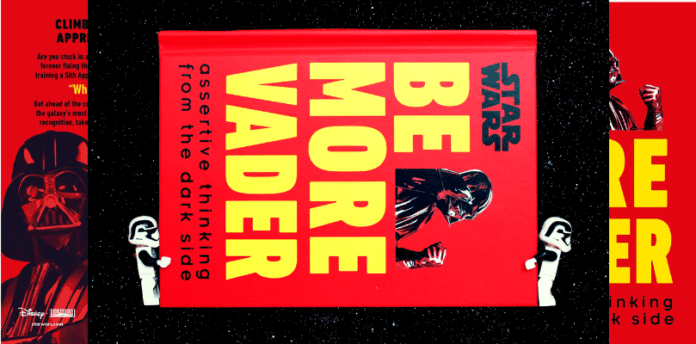 A pair of LEGO stormtroopers carry a book called "Star Wars" "Be More Vader"